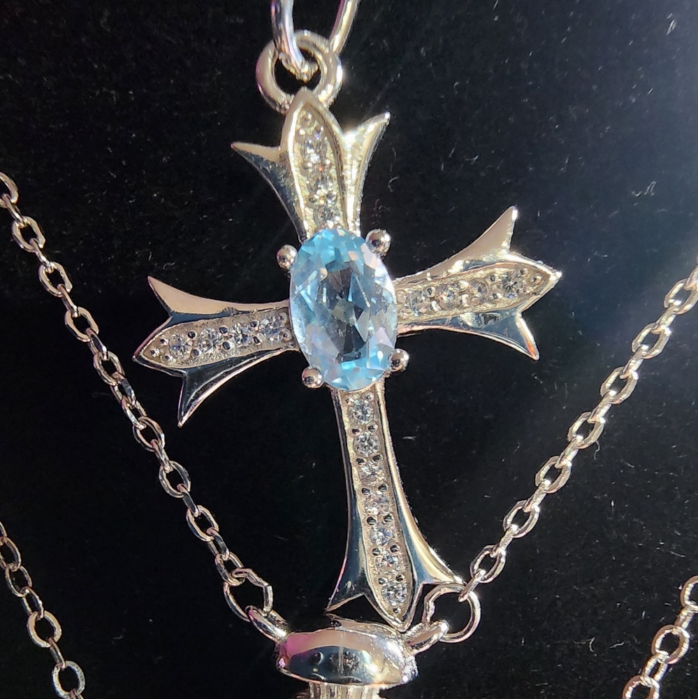 Solid silver cross with a Swiss blue topaz.This one is a beauty